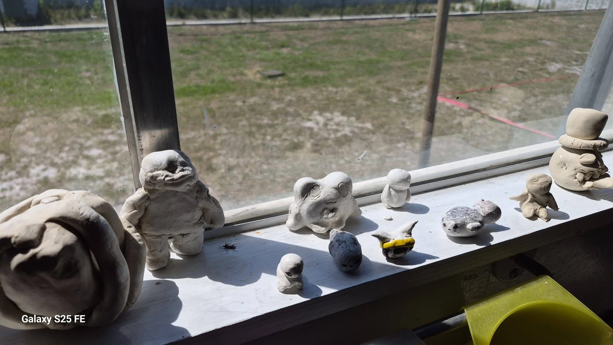 Student clay sculptures on display at Genesis Prep
