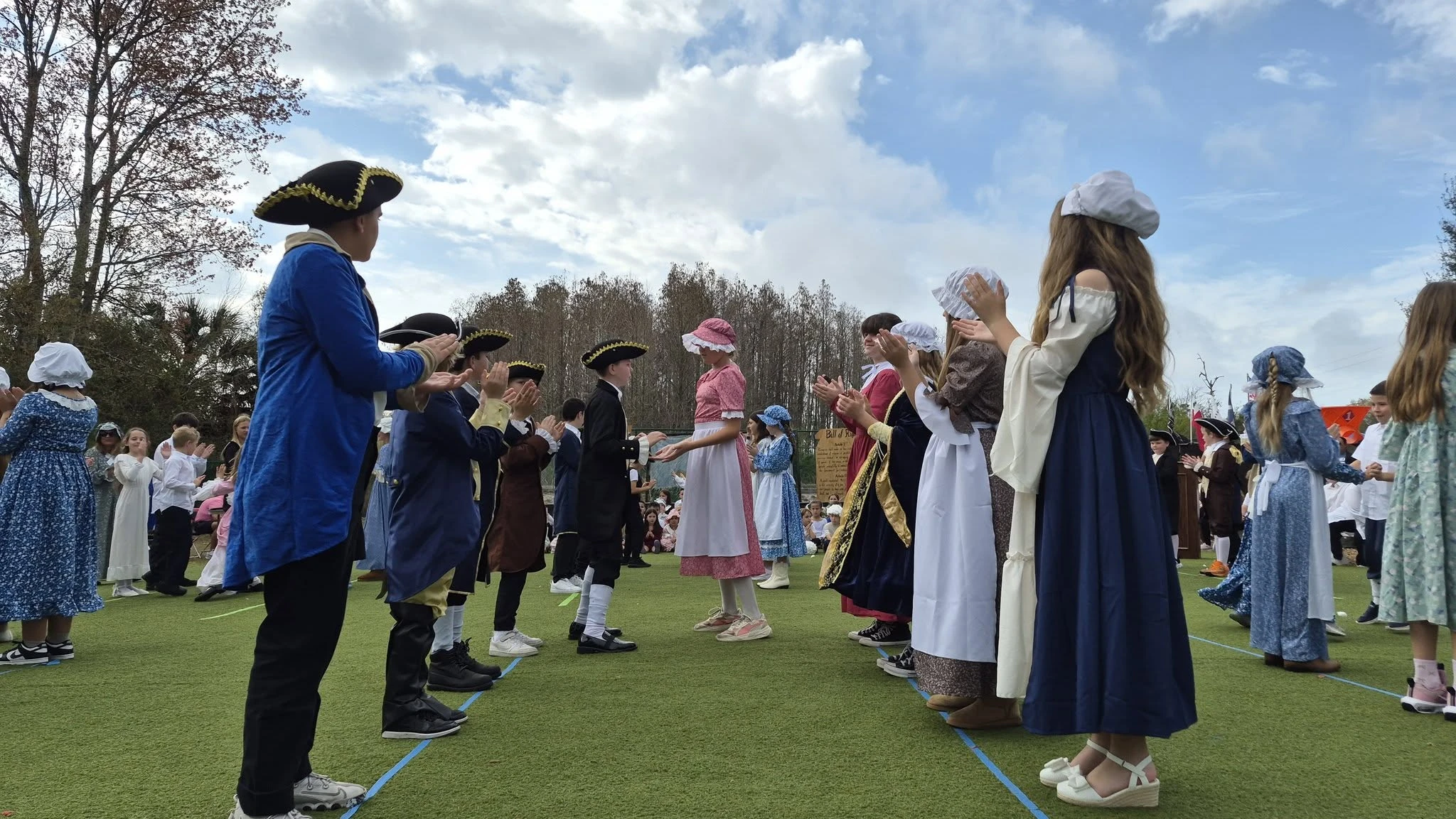 Genesis Prep students performing a colonial dance