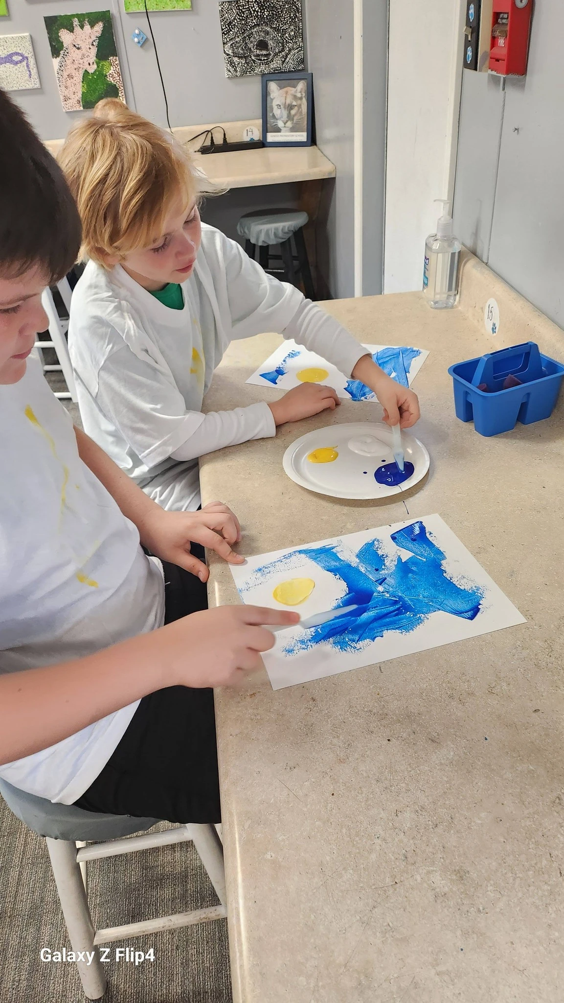 Genesis Elementary students painting in art class
