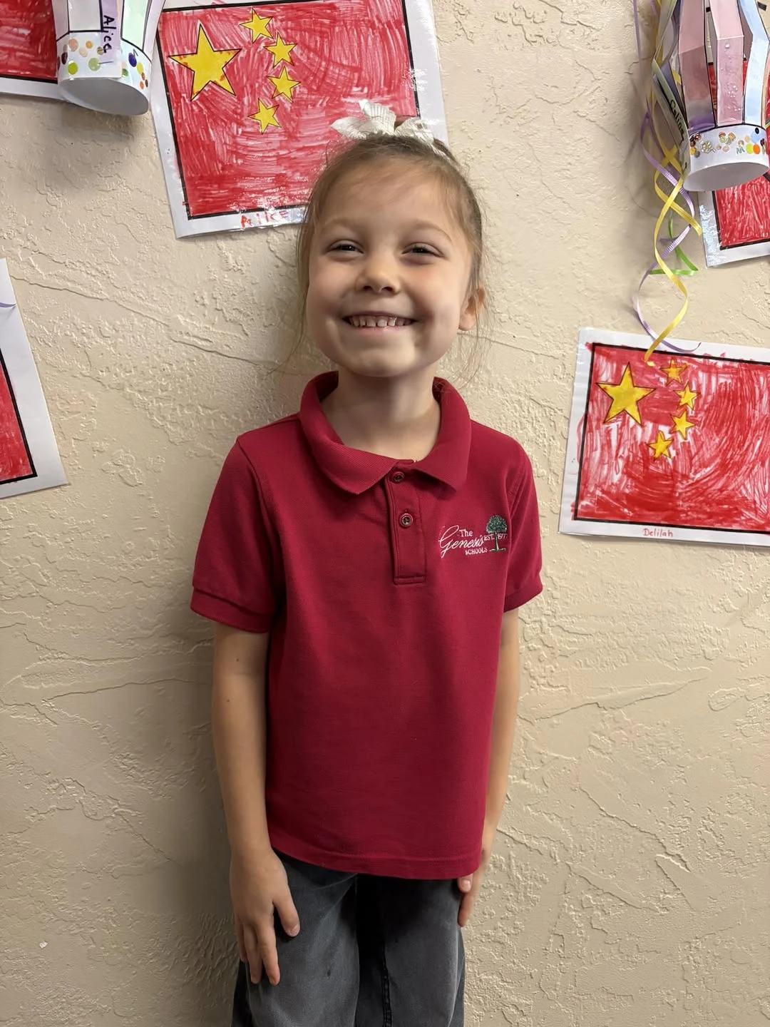 Genesis Elementary student with world cultures flag project