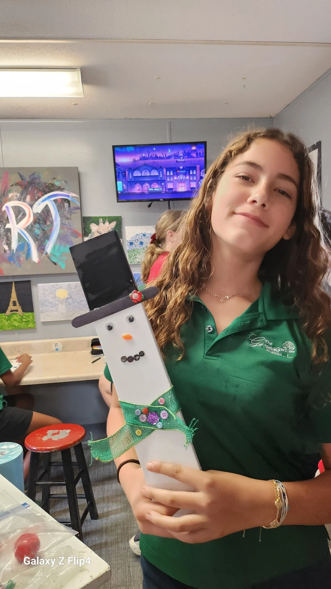 Genesis Middle School student with snowman art project