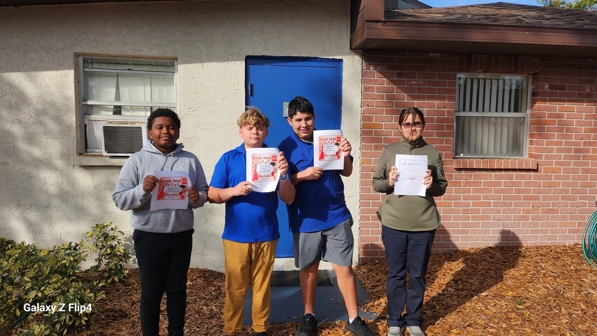 Genesis Middle School students receiving Spanish awards