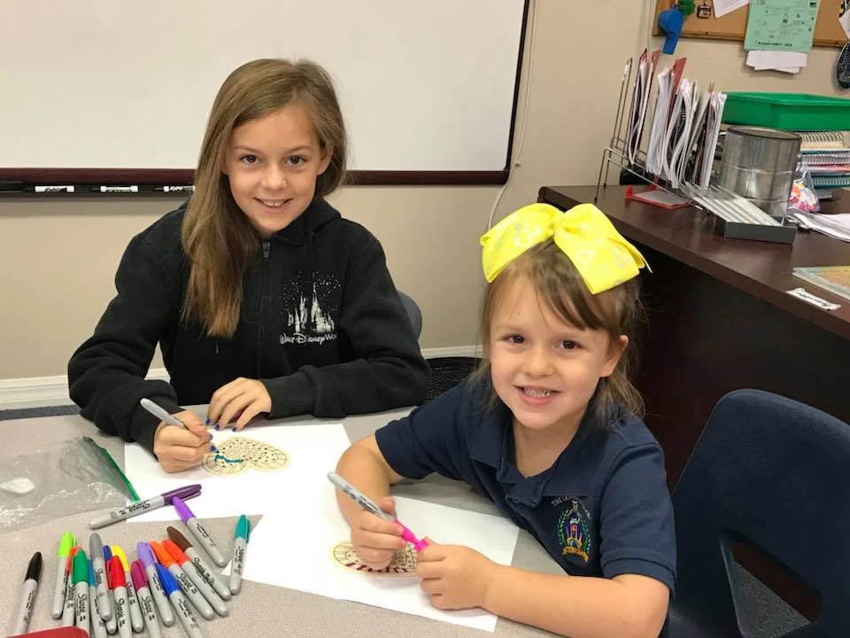 Genesis Prep students working together at their desks